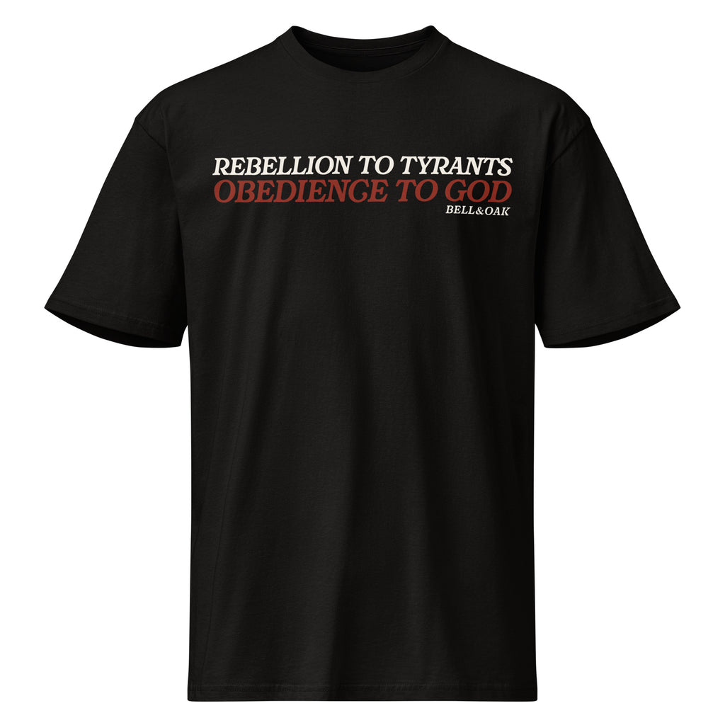 black Graphic t-shirt featuring the phrase "Rebellion to Tyrants Is Obedience to God" in a timeless American heritage design