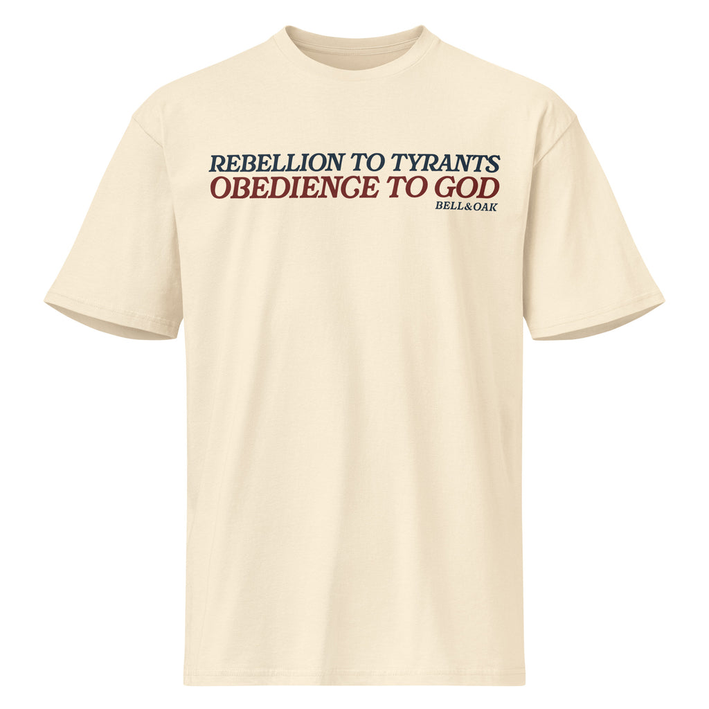 Graphic t-shirt featuring the phrase "Rebellion to Tyrants Is Obedience to God" in a timeless American heritage design
